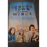 A vintage large 'Wings' advertising poster for the album London Town and an ABBA Greatest Hits