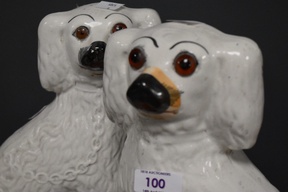 Two Staffordshire pottery dogs and a similar smaller example. - Image 3 of 4