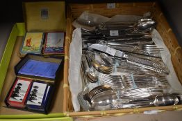 A mixed lot of Community Plate cutlery and two packs of vintage playing cards.