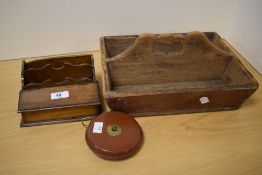 A 19th Century pine cutlery tray, measuring 33cm long, a vintage leather measuring tape, and a