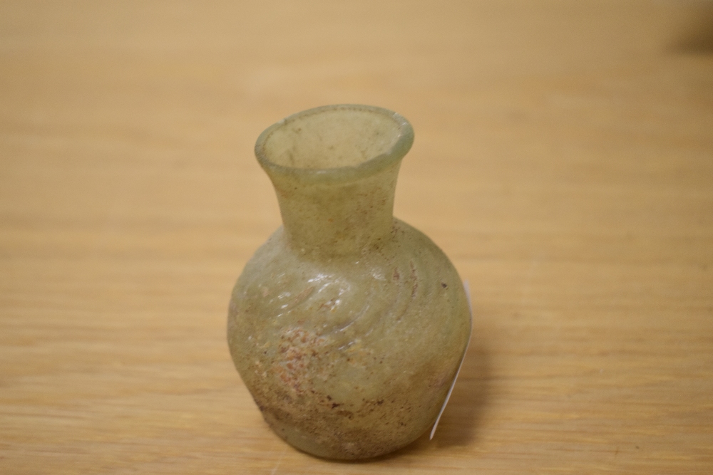 A small Roman glass jar, c.1st-4th Century AD, measuring 6cm tall, with certificate of authenticity - Image 2 of 2