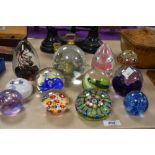 Twelve assorted paperweights including Caithness, Moon Crystal and Strathearn.