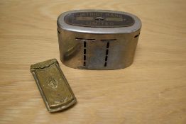 A vintage District Bank money box and a Victorian brass needle case.