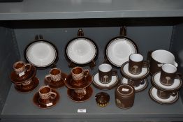 An assortment of Hornsea pottery and similar mid century coffee cups and saucers.