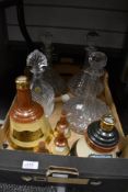 A selection of Bells whisky collectables and four cut glass decanters.