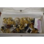 Two jewellery boxes containing an assortment of costume jewellery, including statement floral