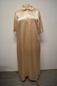 A vintage blush ivory coloured glossy satin nightdress.