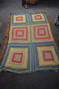 A large bright and cheerful vintage crocheted blanket, AF, some wear.