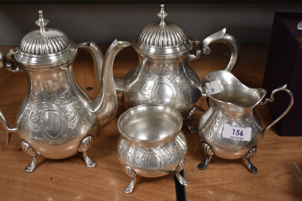 A plated tea/coffee set comprising tea/coffee pot, water jug, sugar bowl and creamer.