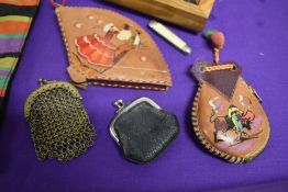 Two antique coin burses, a 1930s handkerchief case, a wooden box of buttons and trinkets and two