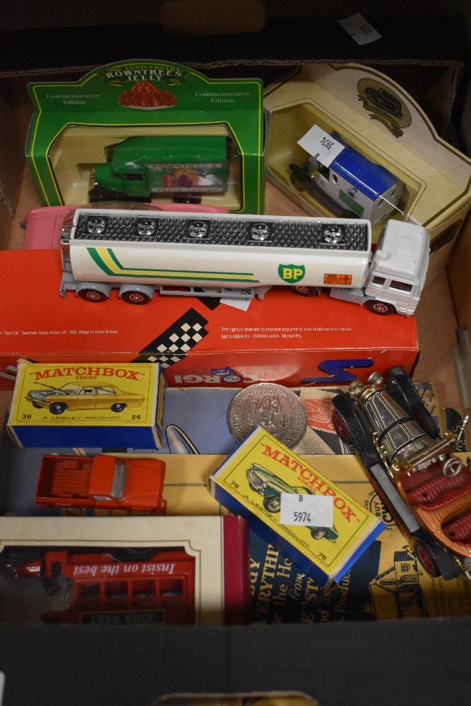 A small amount of die cast toy cars and a small stamp album etc.