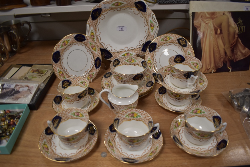 A Crown Chelsea part tea service (21 pieces approx) having brown chequered design with floral