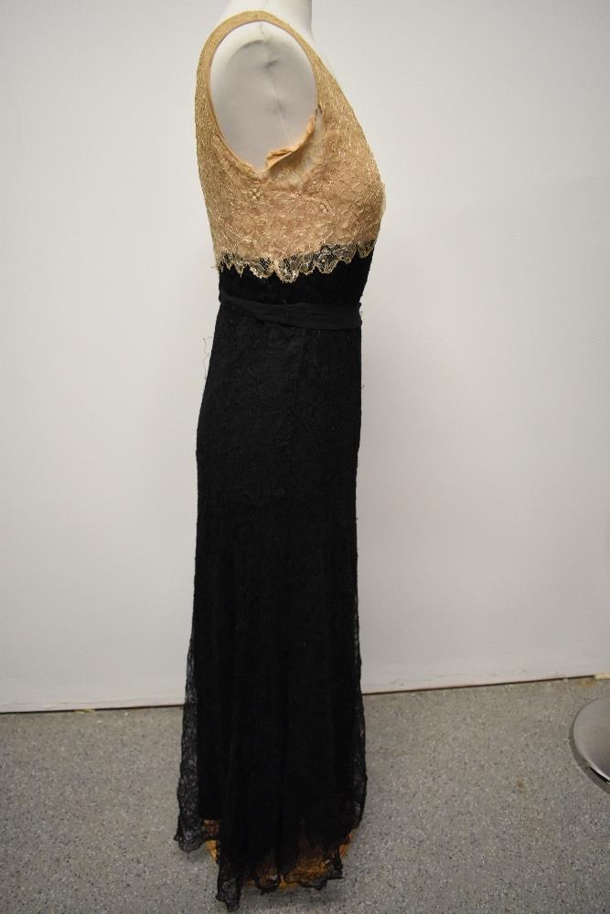 A 1930s two tone cream and black lace evening gown. - Image 9 of 10