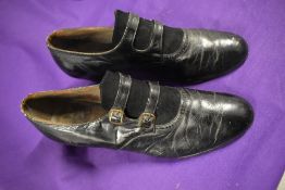 A pair of Edwardian black leather and suede shoes, having buckle detail to front.