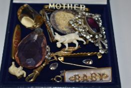 A collection of costume jewellery including various 'baby' brooches, a single nine carat gold drop