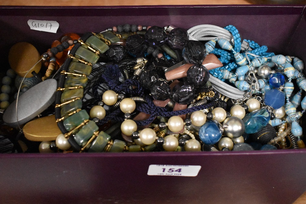 An assortment of costume necklaces including various beaded examples, statement pieces and faux