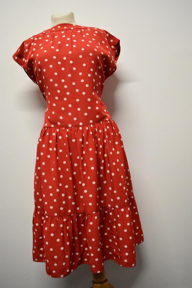 A 1950's red dress, having white polka dot pattern, tiered skirt and rear metal zip, larger size. - Image 4 of 5