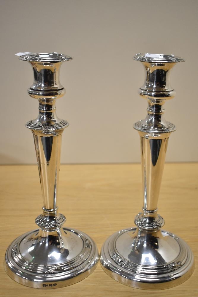 A pair of silver plated candlesticks and two unusual champagne or spirit coasters, having later - Image 2 of 4