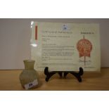 A small Roman glass jar, c.1st-4th Century AD, measuring 6cm tall, with certificate of authenticity