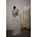A 1930s/ 1940s white lace and grosgrain dress, having tie belt to waist, full length fitted