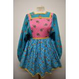 A really fun 1960s smock, in bright floral patterns, having huge sleeves and rear metal zip.