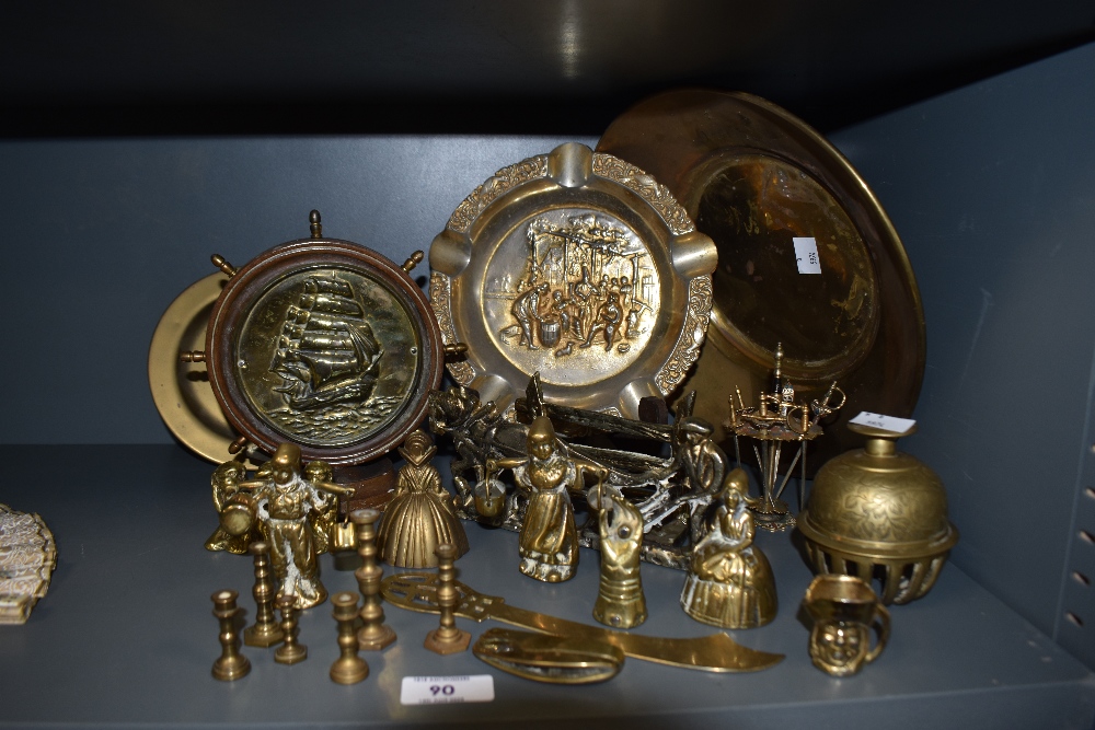 A selection of brass, including bells and large embossed ash tray.