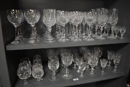A large lot of cut glass and crystal glasses, including Royal Doulton, wine glasses, tumblers and