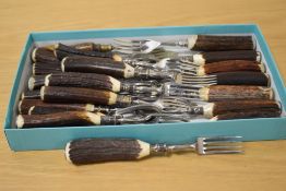 A collection of horn handled forks.