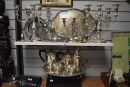 A large assorted selection of silver plated ware to include a pair of Victorian style five sconce