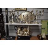 A large assorted selection of silver plated ware to include a pair of Victorian style five sconce