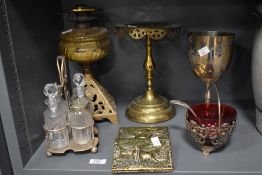 An antique oil lamp with cast metal base (void of chimney) a cruet set, a letter rack, a silver