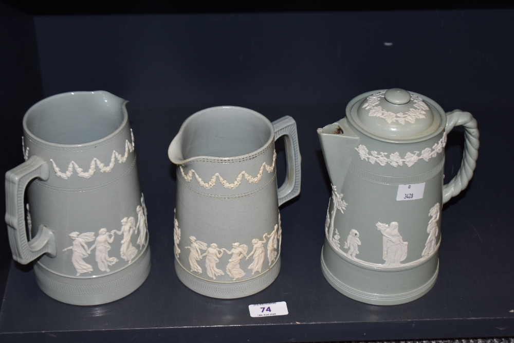 Two Copeland Spode stoneware jugs, decorated with classical figures against a pastel ground, and a