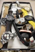 A collection of wristwatches including two smart watches, a digital Lorus, Accurist, Henley and