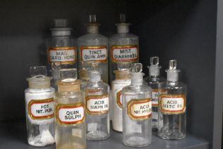 A collection of Victorian glass apothecary/chemists bottles with stoppers, the largest measures 20cm