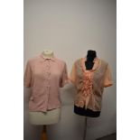 Two 1950s pink blouses, one of pink crepe with cut work and machine embroidery to collar and