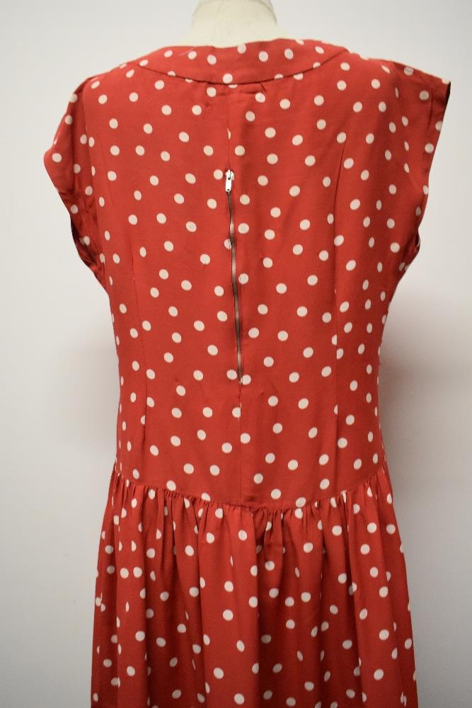 A 1950's red dress, having white polka dot pattern, tiered skirt and rear metal zip, larger size. - Image 3 of 5