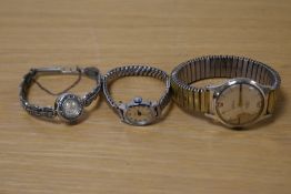 A collection of wristwatches comprising a Smiths Empire, a Timex on an extending bracelet strap
