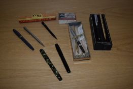 A selection of writing equipment including Papermate ballpoints, a boxed Biro Rollerball, a Conway