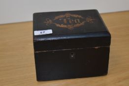 A 19th Century ebonised tea caddy, of rectangular form, with inlaid 'Tea' design to the lid,