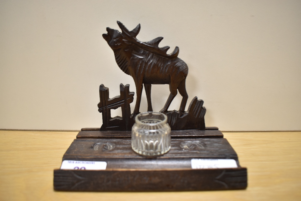 A carved treen ink well/pen stand of primitive form, bearing inscription, having Moose decoration to - Image 3 of 4