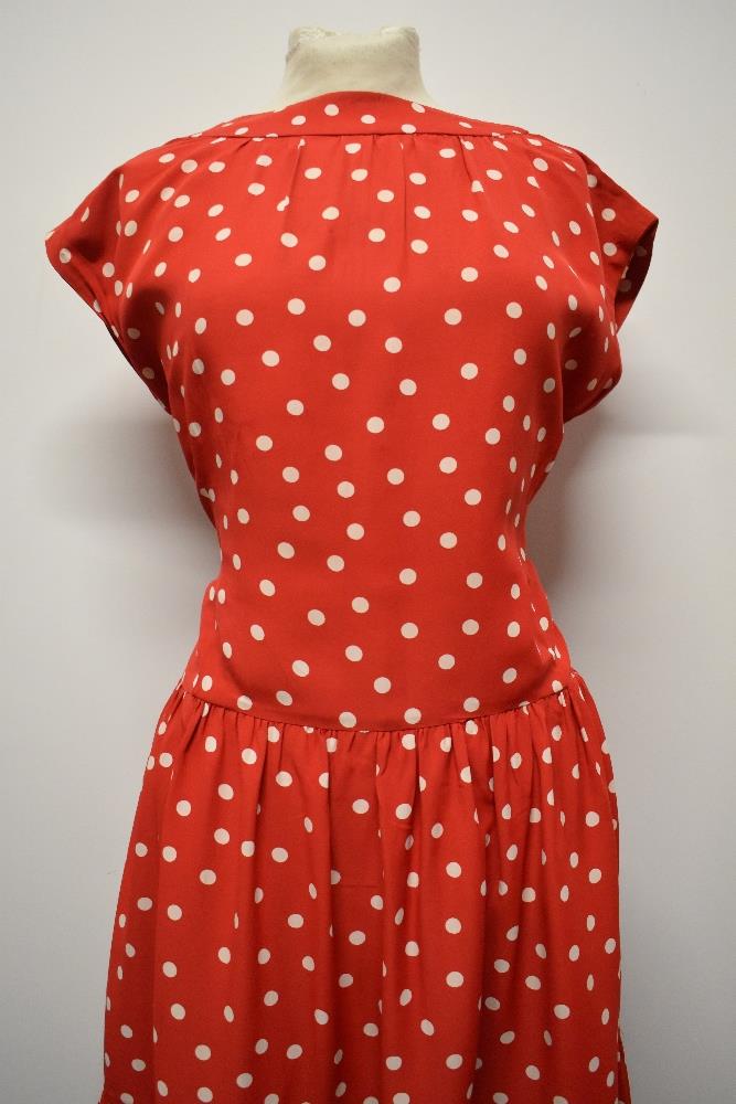 A 1950's red dress, having white polka dot pattern, tiered skirt and rear metal zip, larger size. - Image 5 of 5