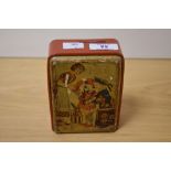 An early 20th Century novelty tinplate money bank, in the form of a valve radio, measuring 13cm