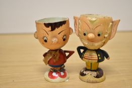 A pair of vintage wooden egg cups, modelled as Enid Blyton characters, Noddy and Big Ears.