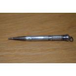 A Victorian silver propelling pencil, hallmarked for Barr Moering & Co., with engraved name to the
