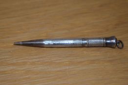 A Victorian silver propelling pencil, hallmarked for Barr Moering & Co., with engraved name to the