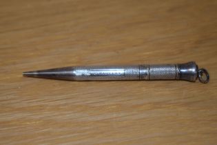 A Victorian silver propelling pencil, hallmarked for Barr Moering & Co., with engraved name to the