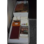 A collection of Bamforth WW1 postcards, a small quantity of assorted vintage stamp albums with loose