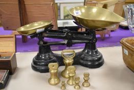 A vintage set of Librasio kitchen scales with brass pans and weights.