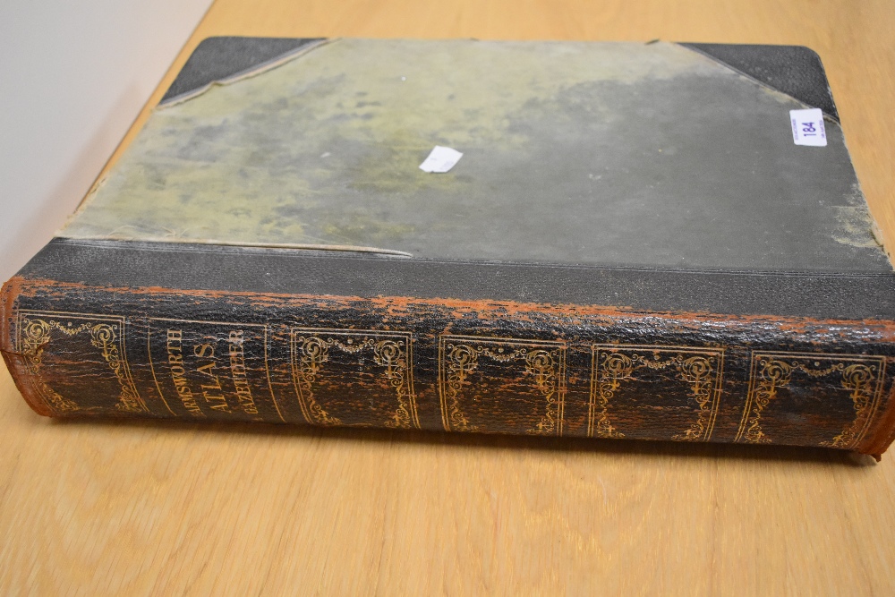 A large Harmsworth Atlas and Gazetteer, wear to cover.