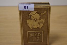 A Burnley Building Society money box.